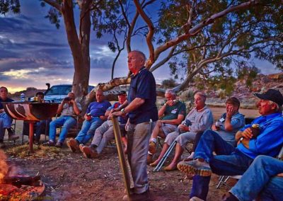 Tom addressing volunteers at the happy hour