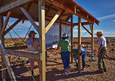 Sanding and laquering the timbers of the ANZAC story-board