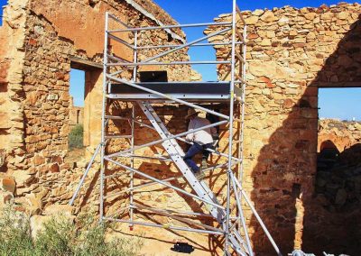 Stonemasons rebuilding wall Exchange Hotel