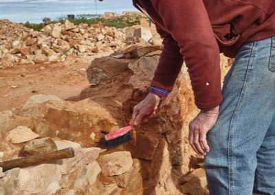 Ross Murphy cleaning out old mortar