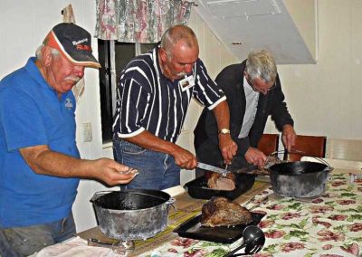 Freshly cooked meat out of the camp ovens being sliced for the hungry workers.