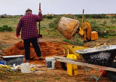 Mario Viaina mixing lime mortar for pointing.