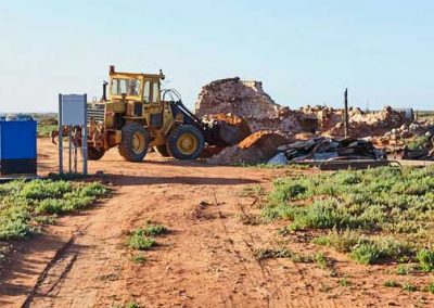 Kevin Dawes removes sand overburden from the station site.