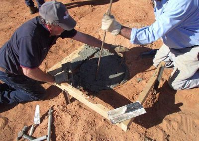 Concrete pouring into the footings