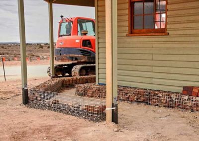 The rock Gambions which are along the front and sides of the Patterson house