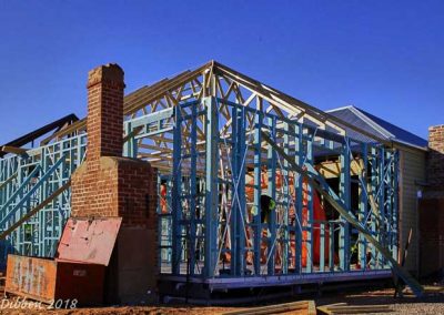 The two original chimneys fit in with the rebuilt structure.