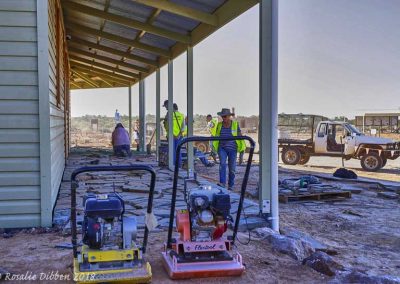 Slate flooring in place and grouting in progress.