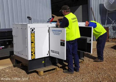 New (larger) Diesel generator being prepared for placement and installation.