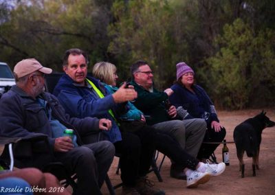 Around the camp fire during the "Happy Hour".