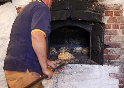 Removing baked product with the peel.