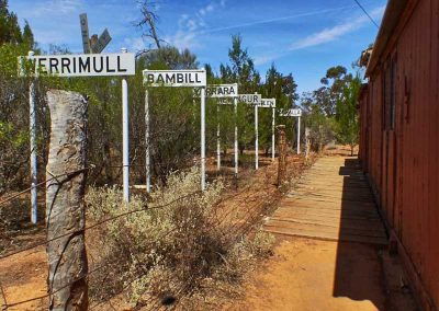 Various (now disused) railway siding signs now stand alongside one of the freight cars at the Meringur museum.